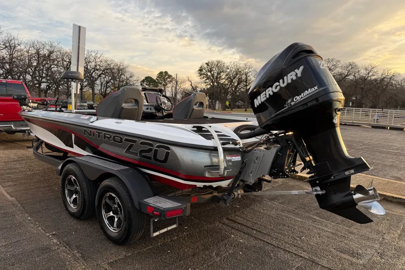 Slide: The Image of 2020 Nitro Z20 boat seat with logo, outdoor setting, other boats in background. - 42
