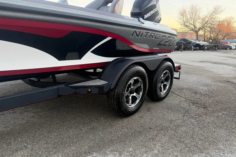 Slide: The Image of 2020 Nitro Z20 boat at sunset by a lake, featuring a Mercury engine. - 5