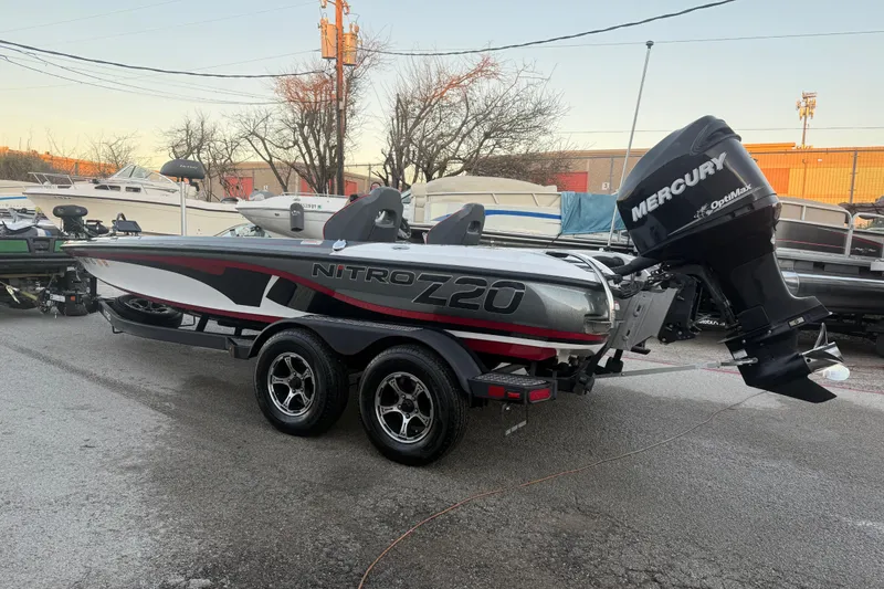 Slide: The Image of 2020 Nitro Z20 boat on trailer at sunset by a lake. - 6