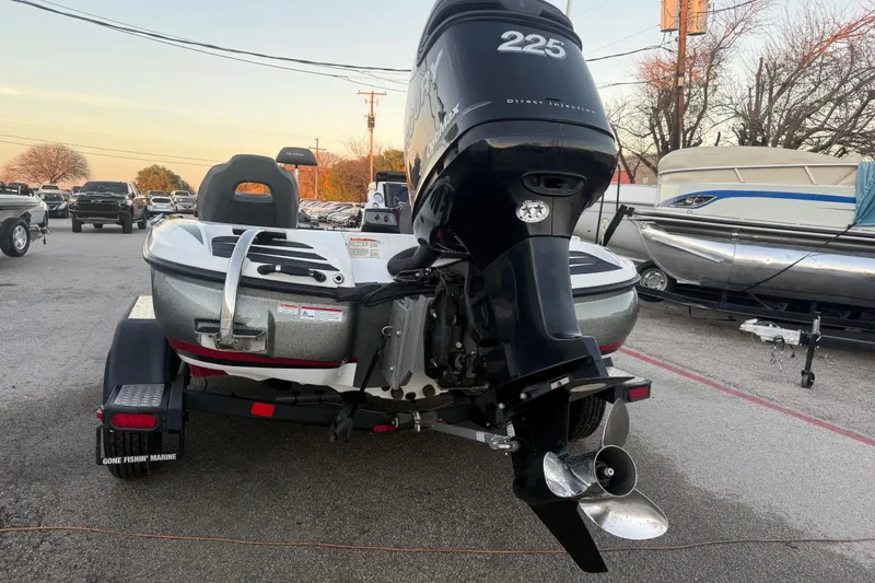 Slide: The Image of 2020 Nitro Z20 boat on trailer at sunset by a lake. - 8