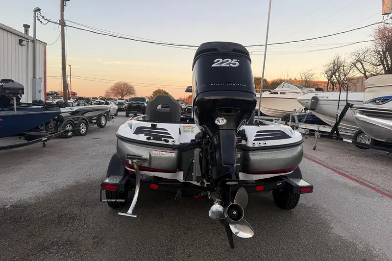 Slide: The Image of 2020 Nitro Z20 boat with Mercury OptiMax engine on trailer at sunset. - 9