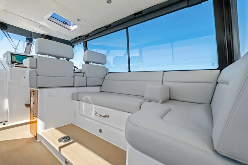 Slide: The Image of Luxurious interior of 2025 MJM 4 yacht with plush seating and panoramic windows. - 10