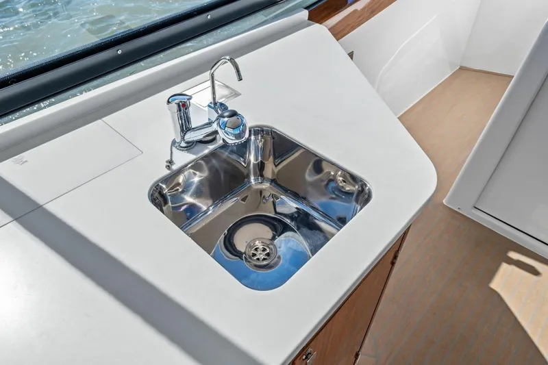 Slide: The Image of Modern sink on MJM 4 yacht, 2025 model, with sleek chrome faucet and countertop. - 13