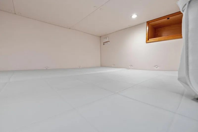 Slide: The Image of Cozy interior cabin space in 2025 MJM 4 model boat, featuring soft lighting and storage. - 17