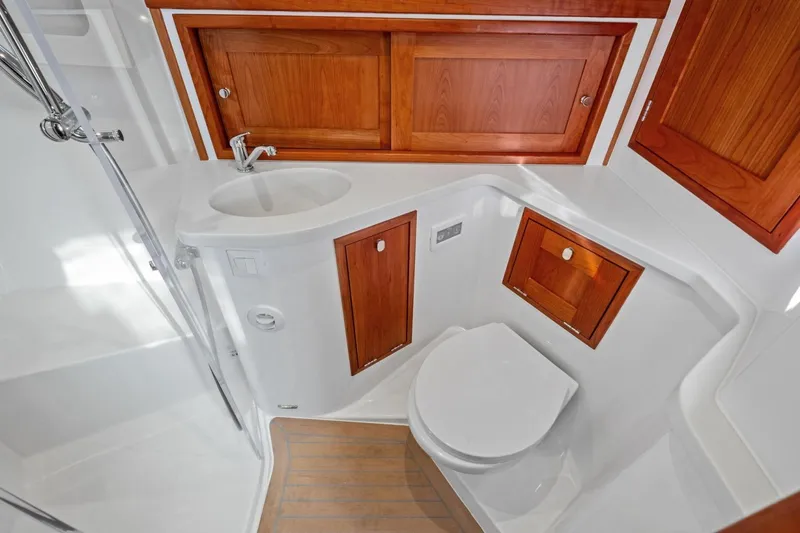 Slide: The Image of Luxurious 2025 MJM 4 yacht bathroom with wooden cabinets and modern fixtures. - 19