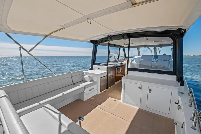 Slide: The Image of Luxurious 2025 MJM 4 yacht interior with spacious seating and ocean view. - 28