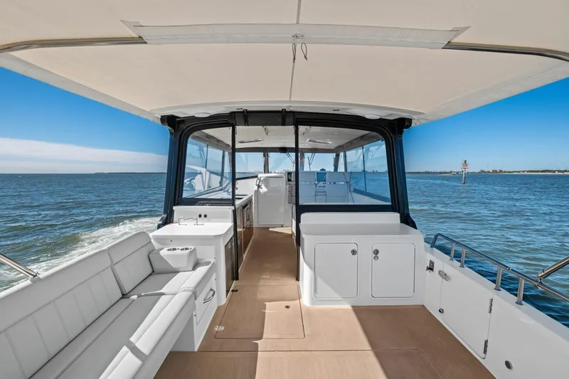 Slide: The Image of 2025 MJM 4 yacht interior with spacious seating and ocean view. - 29