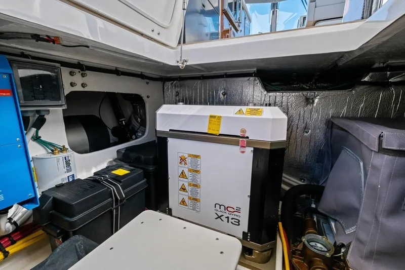 Slide: The Image of Engine room of 2025 MJM 4 boat featuring advanced equipment and insulation. - 32