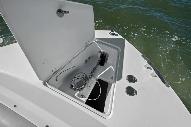Slide: The Image of Open hatch on 2025 MJM 4 boat, revealing anchor storage compartment. - 36