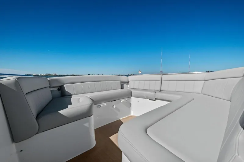 Slide: The Image of Luxurious seating area on 2025 MJM 4 boat under clear blue sky. - 37