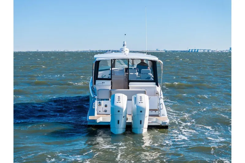 Slide: The Image of 2025 MJM 4 boat with dual engines cruising on open water. - 52