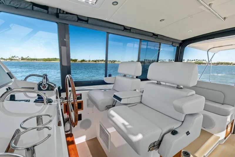 Slide: The Image of Luxurious interior of 2025 MJM 4 yacht with plush seating and scenic ocean view. - 7