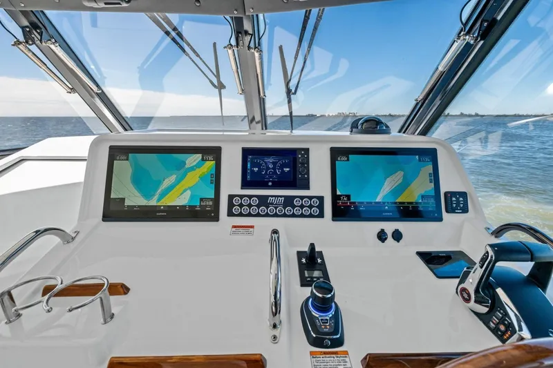 Slide: The Image of Helm of 2025 MJM 4 boat with advanced navigation displays and controls. - 9