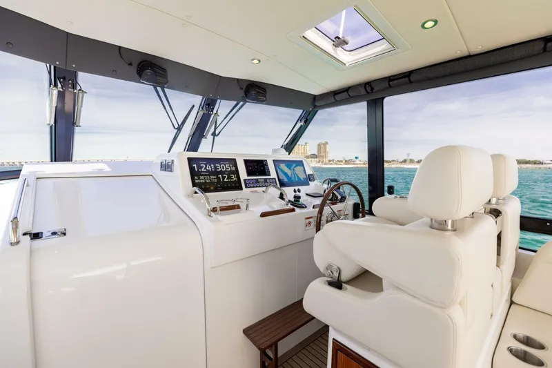 Slide: The Image of Luxurious helm of 2025 MJM 4 yacht with advanced navigation systems and plush seating. - 11