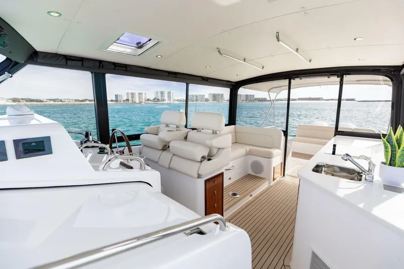 Slide: The Image of Luxurious interior of 2025 MJM 4 yacht with modern seating and ocean view. - 12