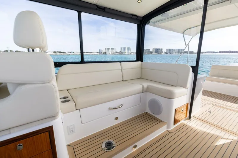 Slide: The Image of Luxurious interior of 2025 MJM 4 yacht with beige seating and ocean view. - 13