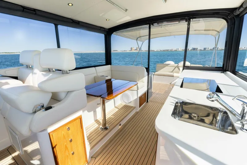 Slide: The Image of Luxurious interior of 2025 MJM 4 yacht with elegant seating and kitchenette. - 17