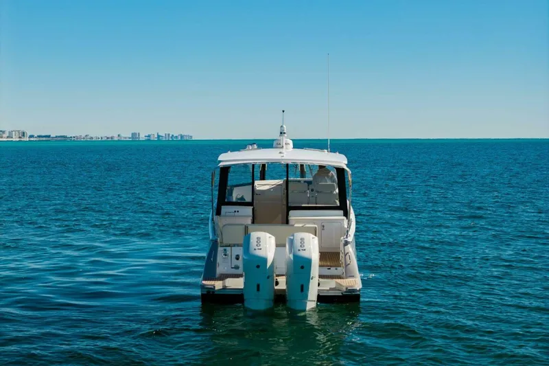 Slide: The Image of 2025 MJM 4 boat on open water with city skyline in background. - 46