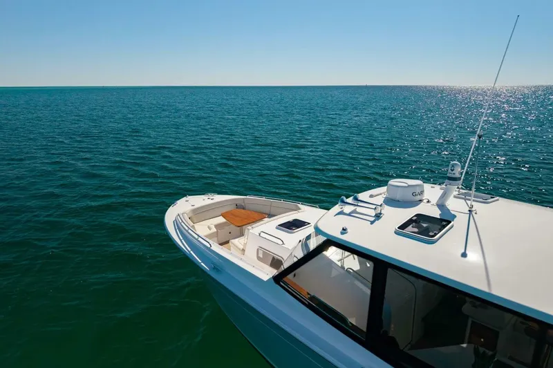 Slide: The Image of 2025 MJM 4 yacht cruising on open sea under clear blue sky. - 49