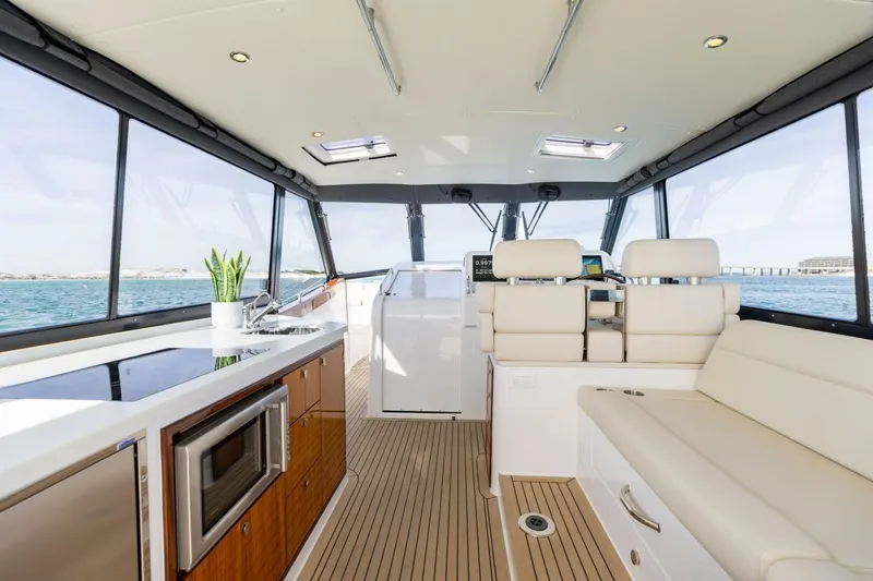 Slide: The Image of Luxurious interior of 2025 MJM 4 yacht with modern kitchen and seating area. - 8