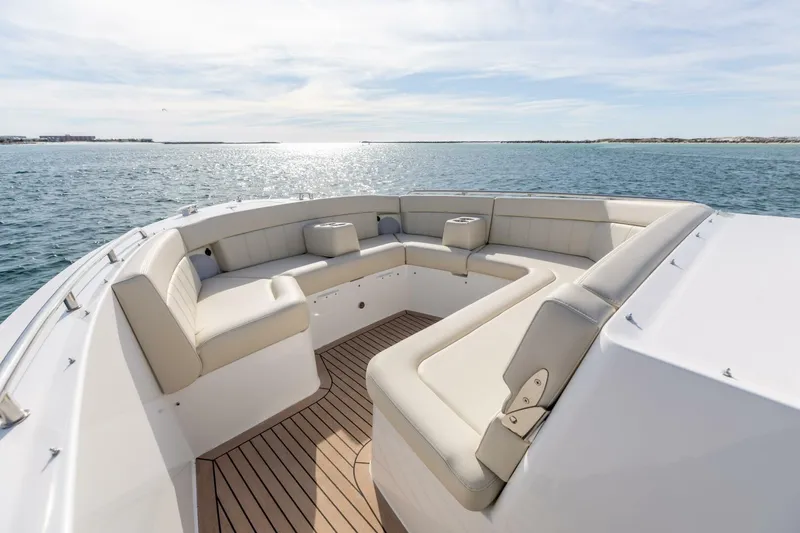 Slide: The Image of Luxurious seating on 2025 MJM 4 boat, overlooking serene ocean waters. - 9