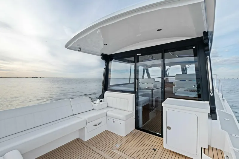 Slide: The Image of Luxurious 2025 MJM 42 yacht with spacious deck and modern interior on calm waters. - 26