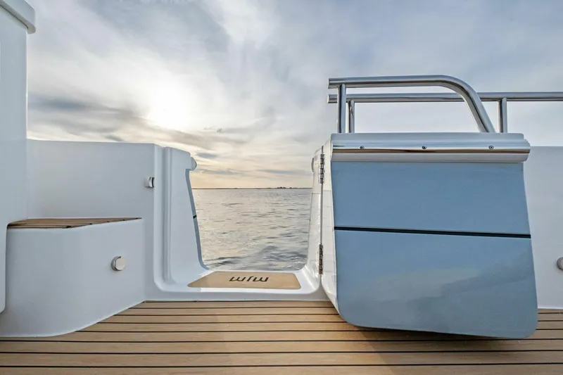 Slide: The Image of 2025 MJM 42 yacht deck with ocean view and sleek design. - 28