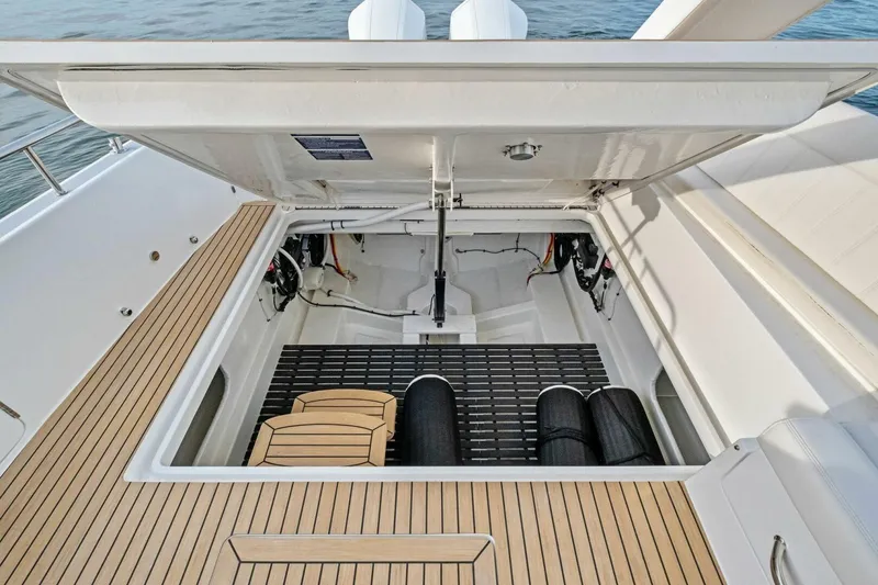 Slide: The Image of Open engine compartment of 2025 MJM 42 boat with teak decking. - 29