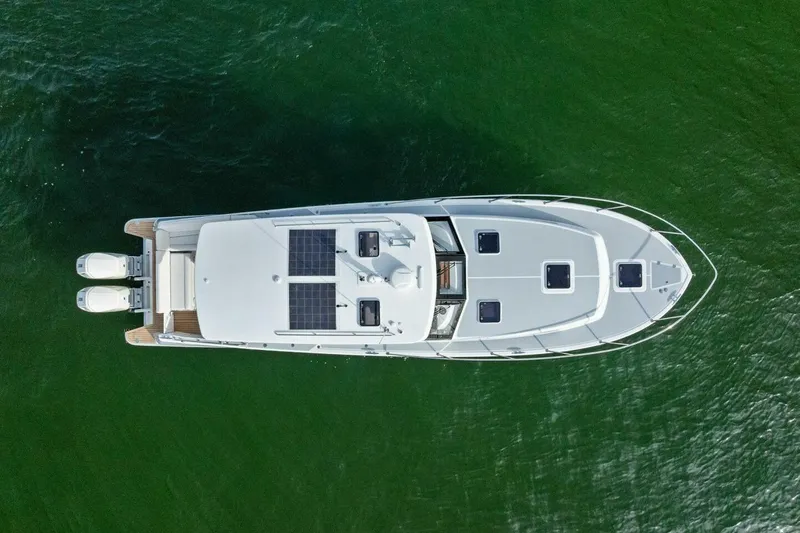 Slide: The Image of Aerial view of 2025 MJM 42 yacht on green water. - 38