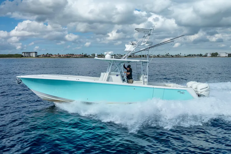 Slide: The Image of 2017 SeaVee 370Z boat cruising on ocean with cloudy sky backdrop. - 14