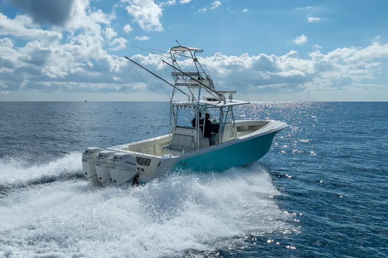 Slide: The Image of 2017 SeaVee 370Z boat cruising on open ocean under a clear blue sky. - 17