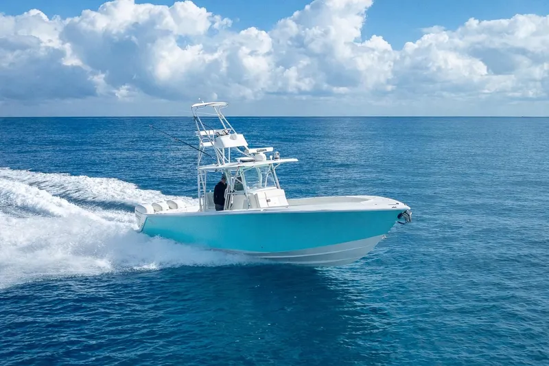 Slide: The Image of 2017 SeaVee 370Z boat cruising on open ocean under blue sky. - 19