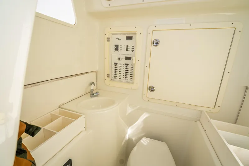 Slide: The Image of 2017 SeaVee 370Z boat interior with sink, control panel, and storage compartments. - 28