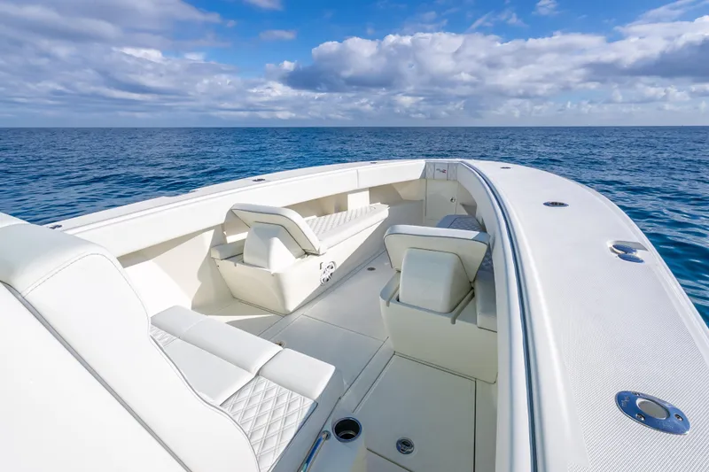 Slide: The Image of 2017 SeaVee 370Z boat with white seating, cruising on open ocean under blue sky. - 34