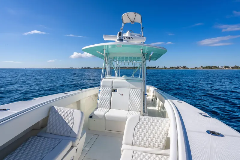 Slide: The Image of 2017 SeaVee 370Z boat on open water, featuring sleek design and luxurious seating. - 39