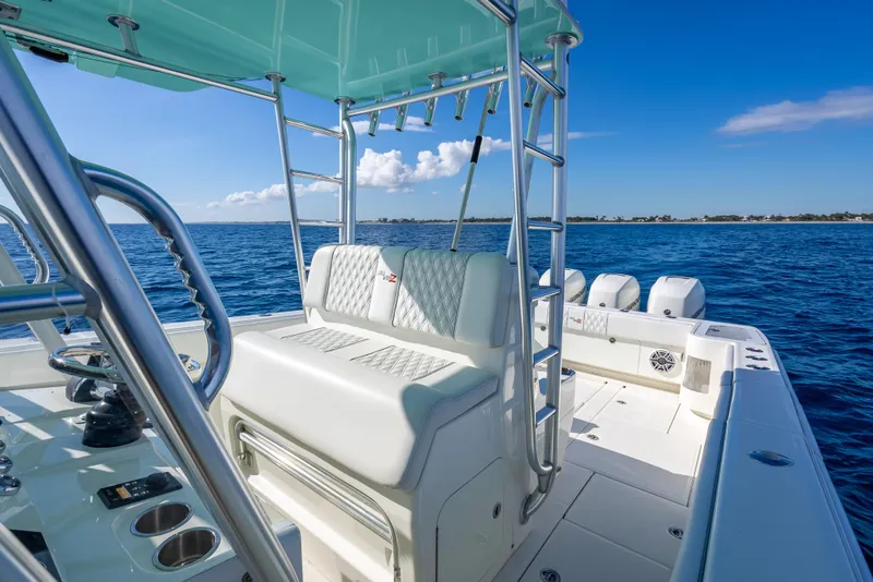 Slide: The Image of 2017 SeaVee 370Z boat interior with seating, ocean view, and clear blue sky. - 42