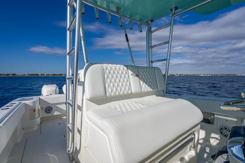 Slide: The Image of 2017 SeaVee 370Z boat interior with white seating and ocean view. - 43