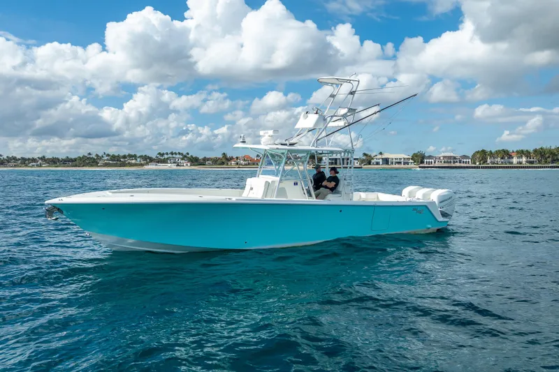 Slide: The Image of 2017 SeaVee 370Z boat on open water under a partly cloudy sky. - 5