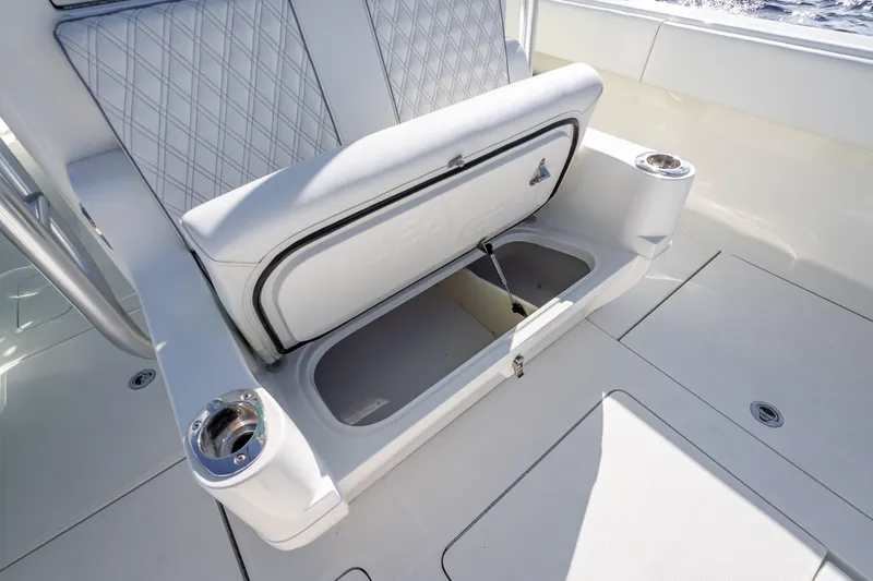 Slide: The Image of 2017 SeaVee 370Z boat with open storage compartment and cup holders on deck. - 52