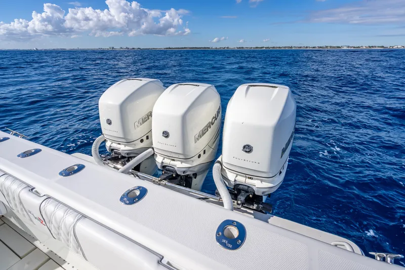 Slide: The Image of 2017 SeaVee 370Z boat with triple Mercury outboard engines on open ocean. - 53