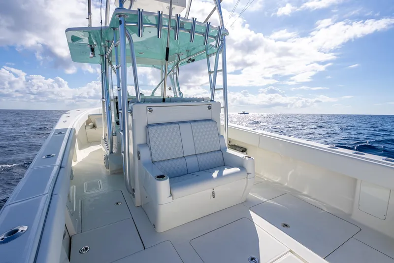Slide: The Image of 2017 SeaVee 370Z boat interior with seating, ocean view, and clear sky. - 58