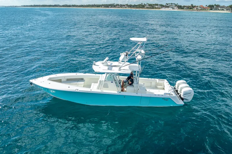 Slide: The Image of 2017 SeaVee 370Z boat on open ocean, featuring dual outboard engines. - 6