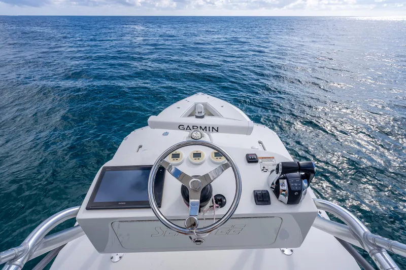 Slide: The Image of Helm of 2017 SeaVee 370Z boat with Garmin navigation, overlooking open ocean. - 61