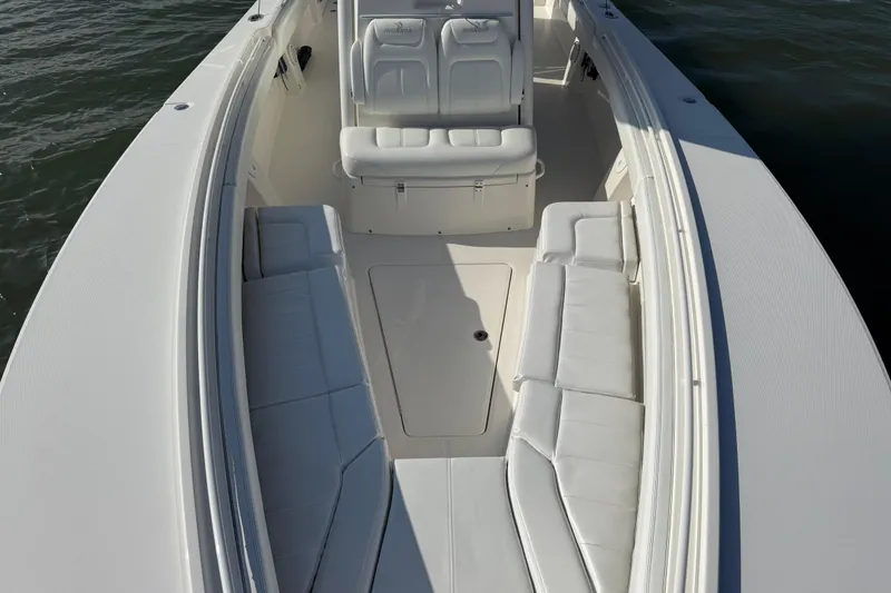 Slide: The Image of 2020 Regulator 31 boat interior with white seating and spacious deck. - 22