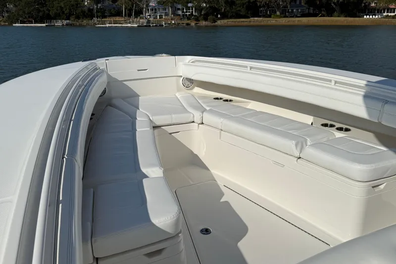 Slide: The Image of 2020 Regulator 31 boat with spacious white seating area on calm water. - 24
