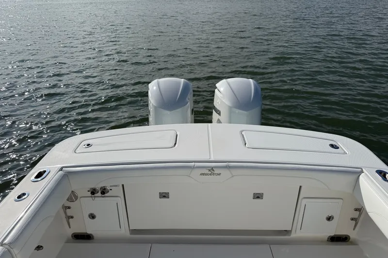 Slide: The Image of 2020 Regulator 31 boat with dual engines on calm water. - 33