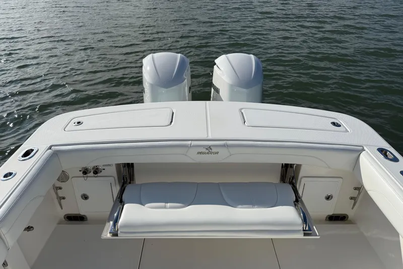 Slide: The Image of 2020 Regulator 31 boat with dual engines on calm water. - 34