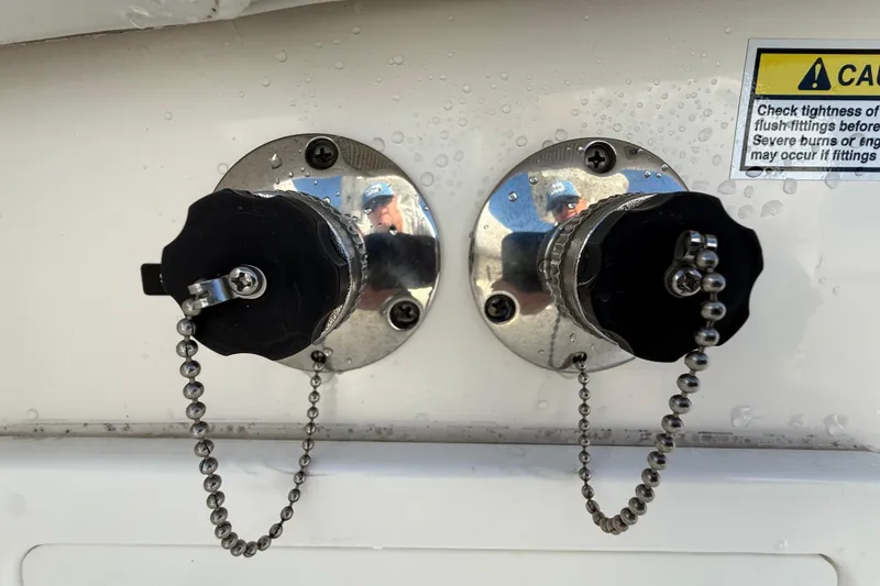 Slide: The Image of 2020 Regulator 31 boat fittings with safety warning label and water droplets. - 42