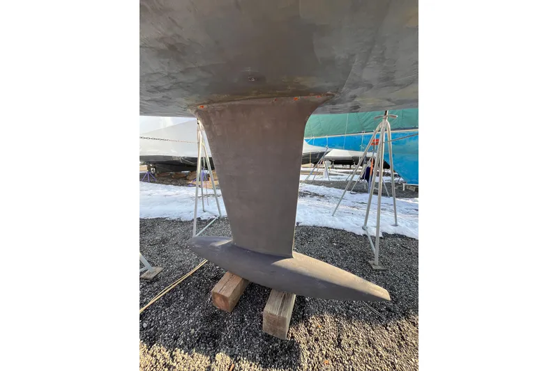 Slide: The Image of Keel of 2007 Beneteau First 10R sailboat on stands, winter storage. - 12