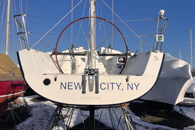 Slide: The Image of 2007 Beneteau First 10R sailboat in New City, NY, docked with snow around. - 19